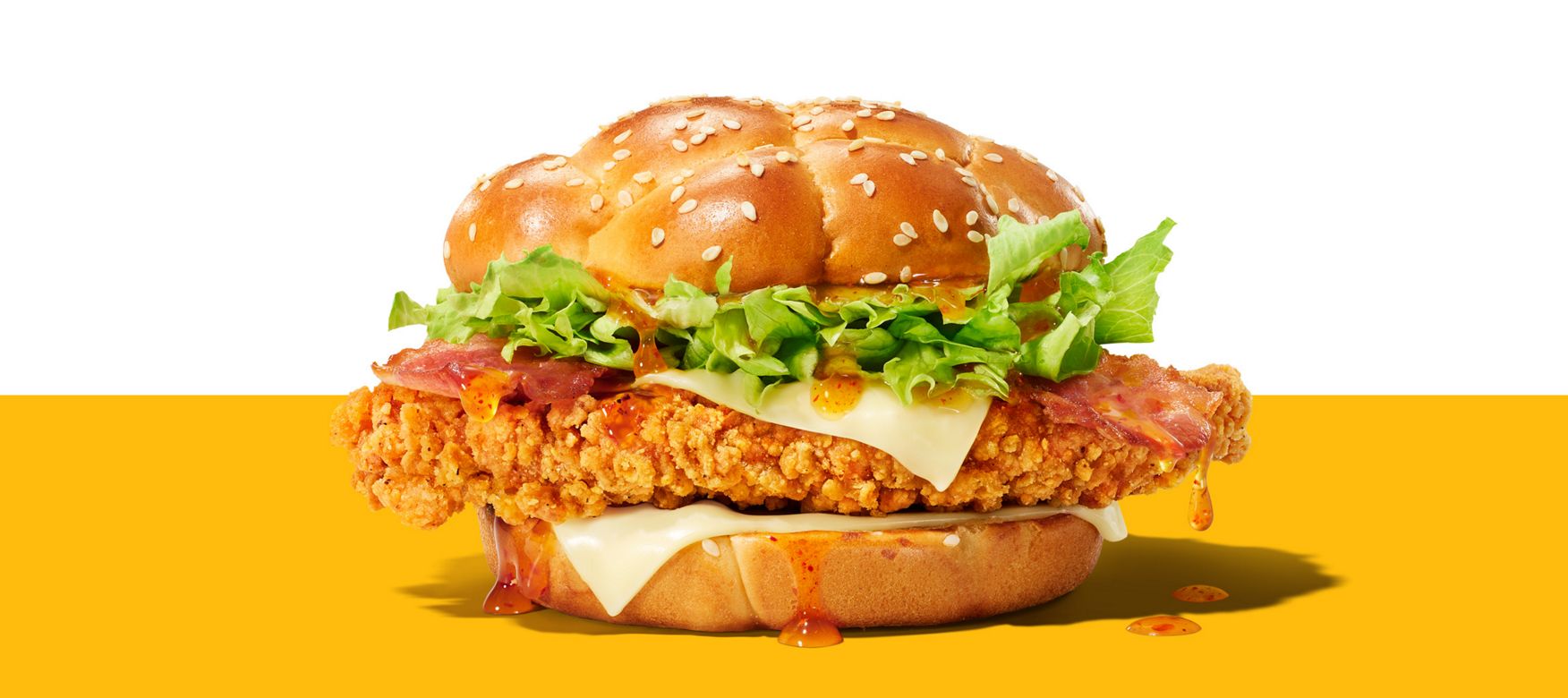 Hot Honey McCrispy chicken burger with bacon, lettuce, cheese and Hot Honey sauce.