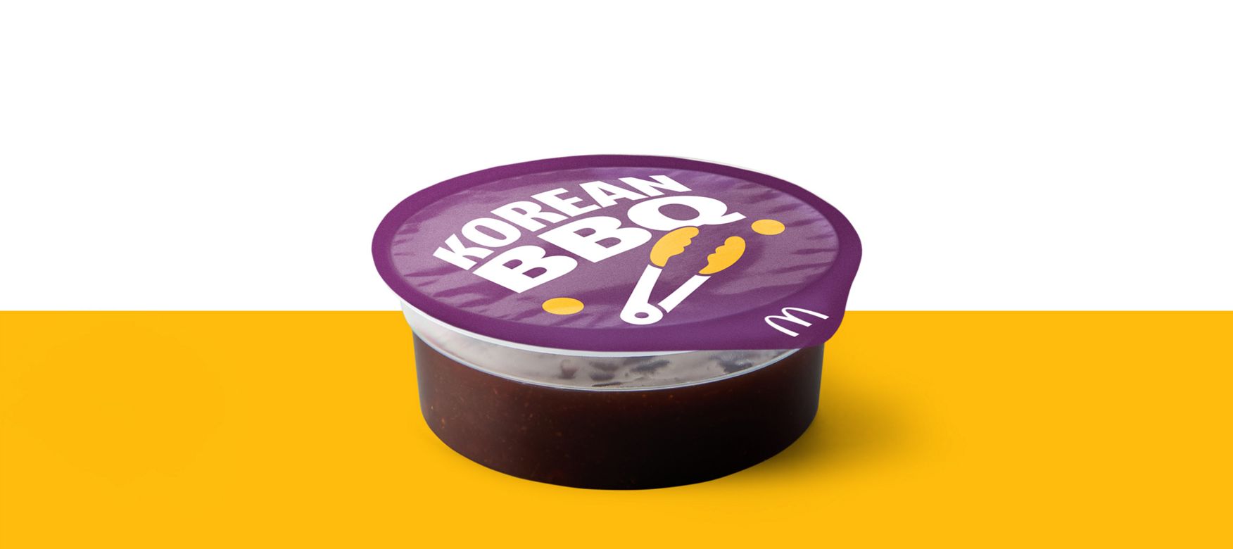 Pot of Korean BBQ dipping sauce with branded purple lid.