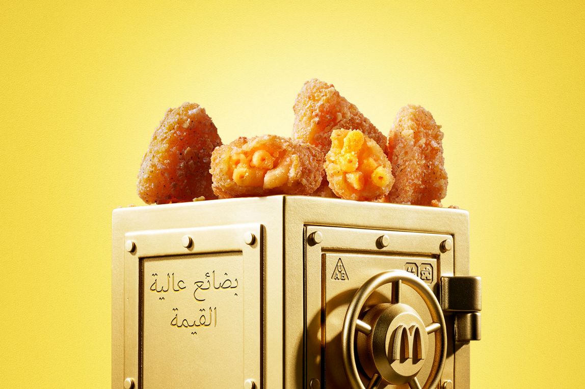 : McDonald’s Mac & Cheese Triangles sits on top of a gold vault.