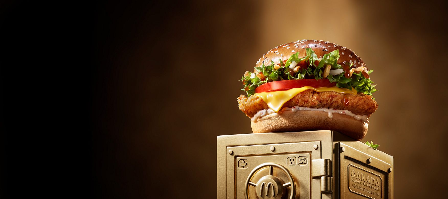 McDonald’s Maple & Cheddar Chicken sits on top of a gold vault.