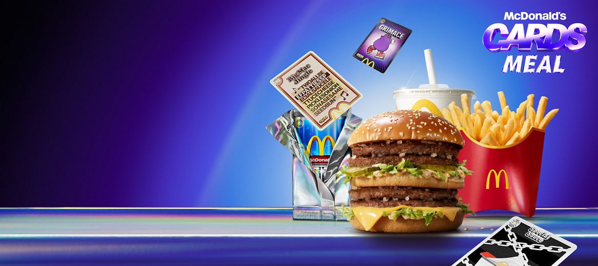 Double Big Mac burger displayed on a blue surface with Cards Meal packaging and floating card graphics behind.