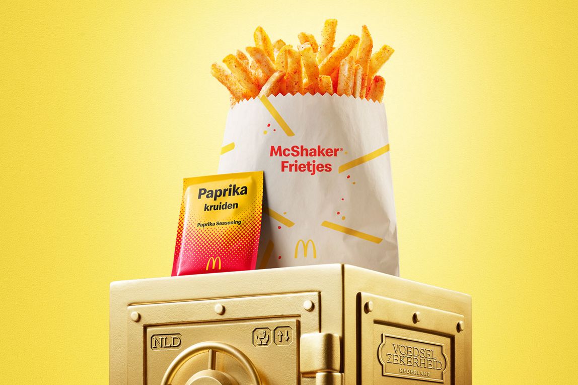 McDonald’s Paprika McShaker® Fries sits on top of a gold vault.