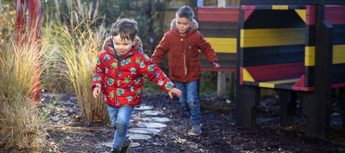 Two children having fun in a playground.