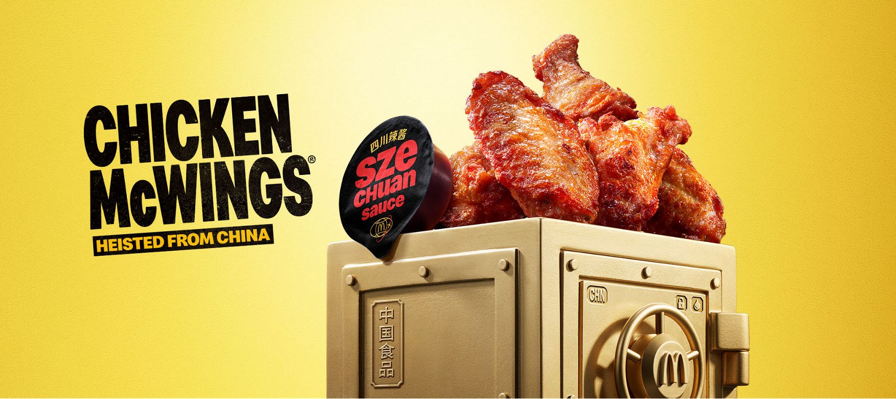 McDonald’s Chicken McWings® and Szechuan sauce sits on top of a gold vault