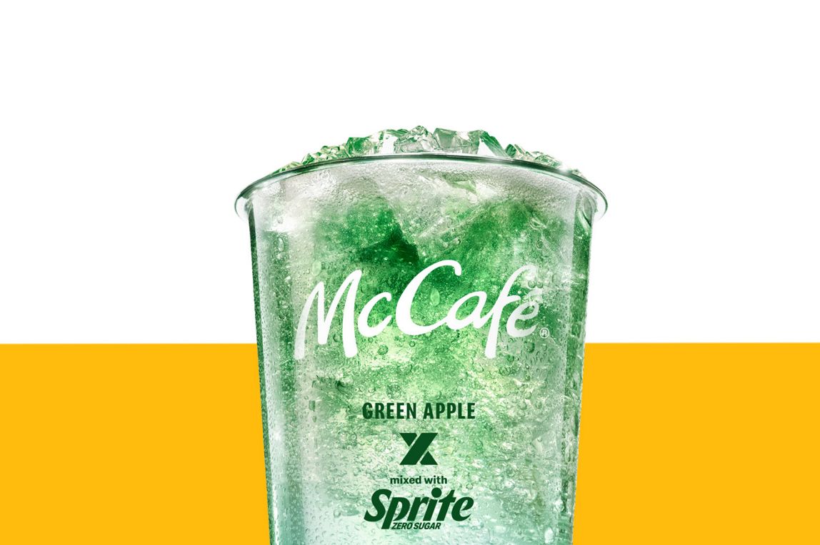 Iced Green Apple x Sprite Zero drink in a clear McCafé cup with a green gradient effect.