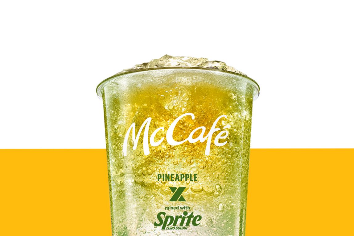 Rasperry and Sprite drink set against a yellow and white background