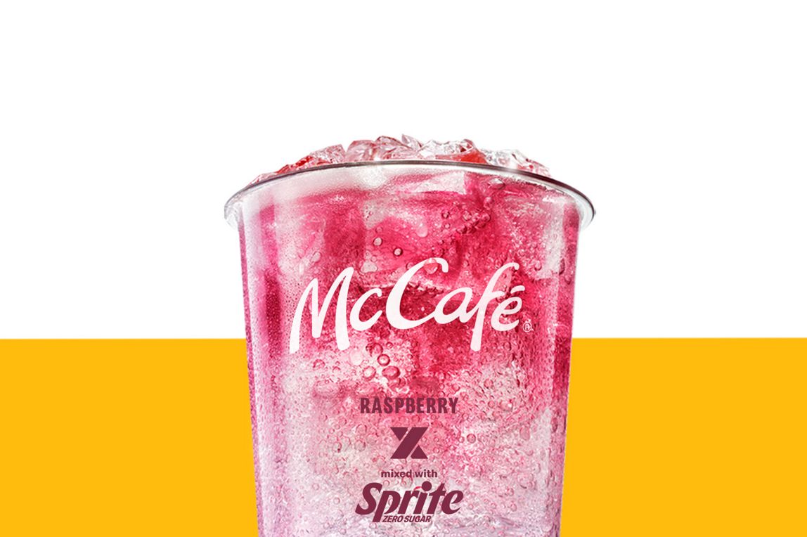 Rasperry and Sprite drink set against a yellow and white background