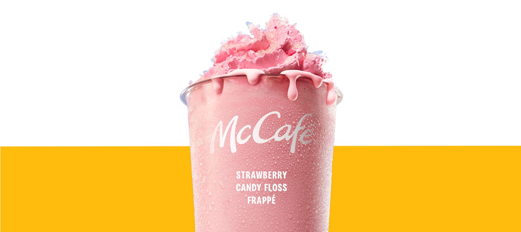 Strawberry Candyfloss Frappe topped with whipped cream and pink candyfloss pieces.