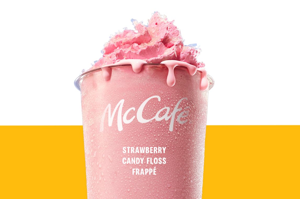 Strawberry Candyfloss Frappe topped with whipped cream and pink candyfloss pieces.
