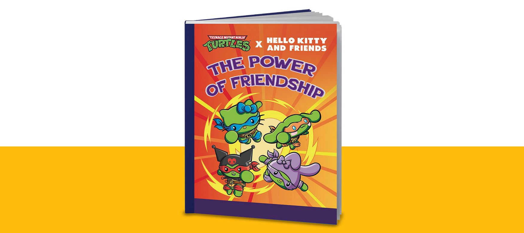 Book titled “The Power of Friendship” featuring Teenage Mutant Ninja Turtles x Hello Kitty and Friends characters on a bright orange and yellow background. The cover shows four colorful cartoon characters with masks and accessories.