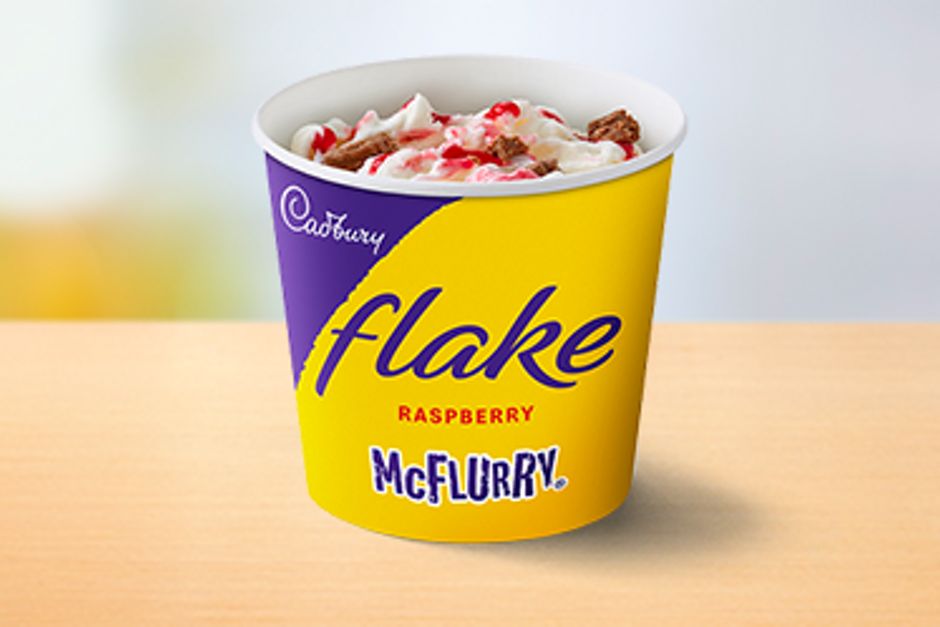 Soft dairy ice cream, swirled with pieces of Cadburys Flake with red Raspberry sauce.