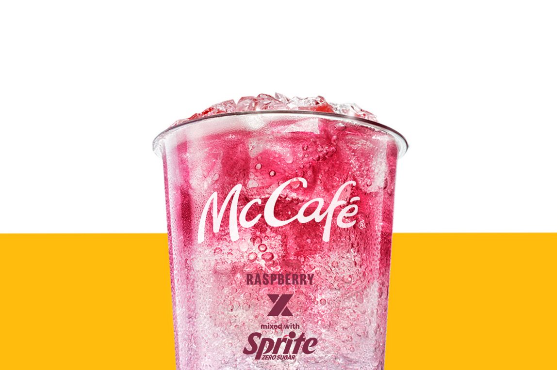 Rasperry and Sprite drink set against a yellow and white background