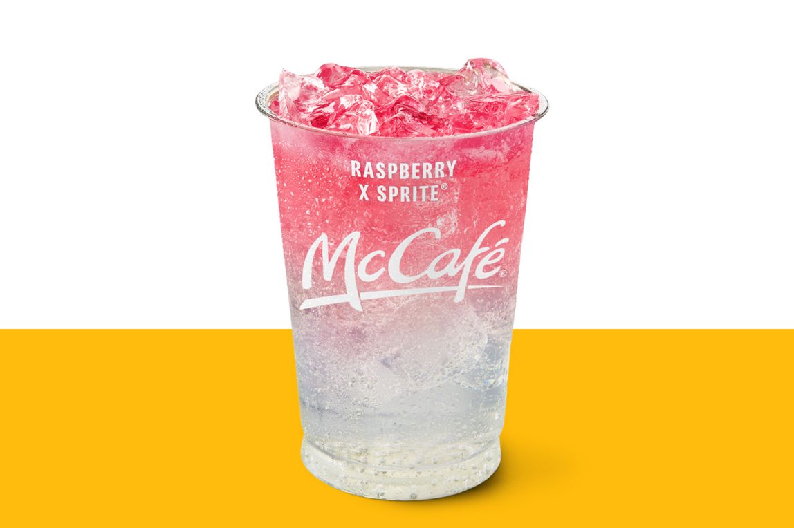 Rasperry and Sprite drink set against a yellow and white background