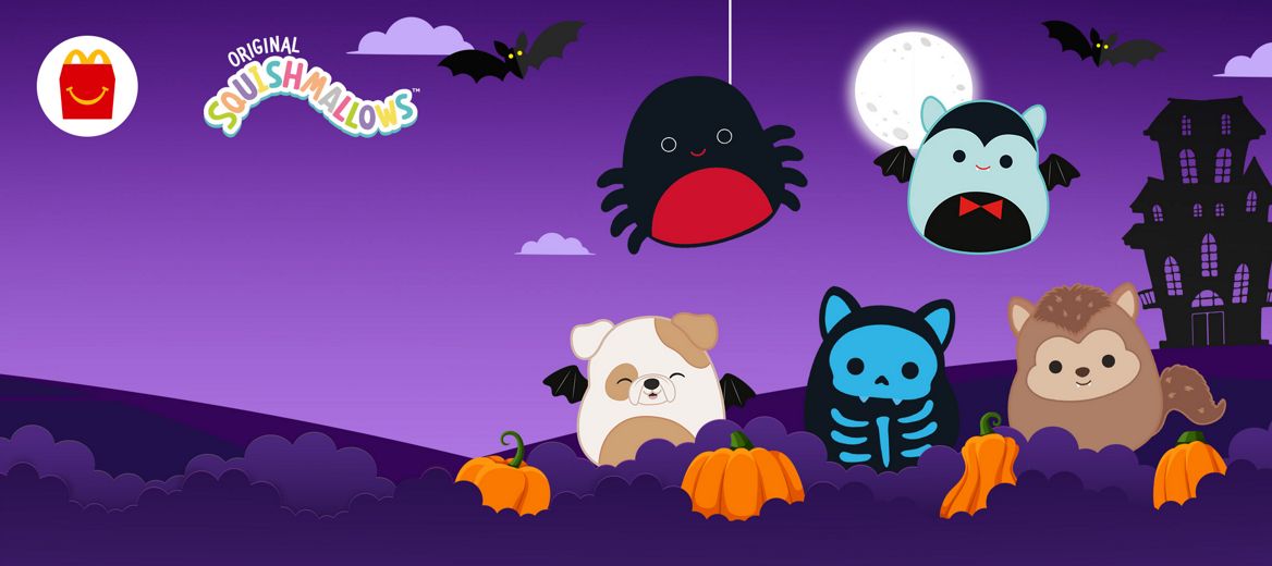  A Halloween purple background with bats, the Moon, pumpkins and a haunted house.