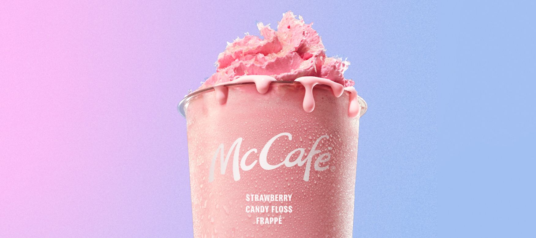 Strawberry Candyfloss Frappe topped with whipped cream and pink candyfloss pieces.