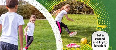 Boys and girls at McDonald’s Fun Football session playing through the gate game on a pitch