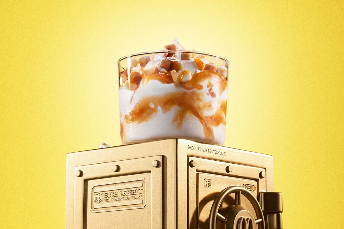 McDonald’s Twix® White Salted Caramel McFlurry® sits on top of a gold vault.