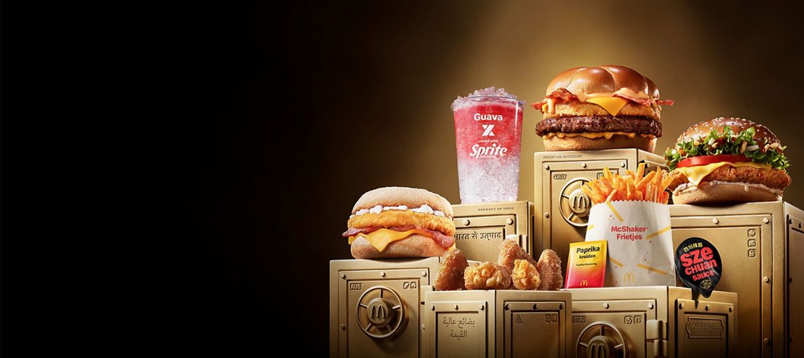 The McDonald's World Menu Heist products all sit on top of gold vaults.