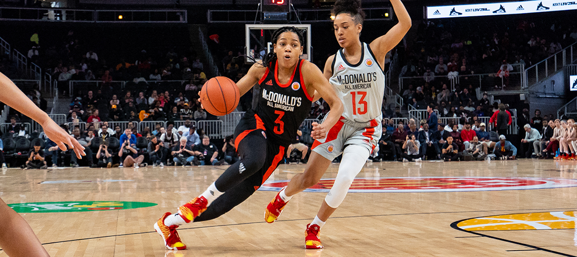 Zia Cooke (3) driving in the ball against Jaden Owens (13) at the 2019 McDonald's All American Girls Game at State Farm Arena in Atlanta.
