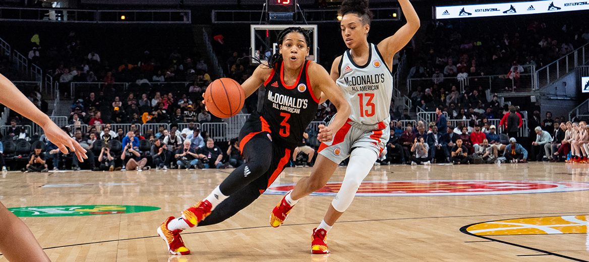 Zia Cooke (3) driving in the ball against Jaden Owens (13) at the 2019 McDonald&#39;s All American Girls Game at State Farm Arena in Atlanta.