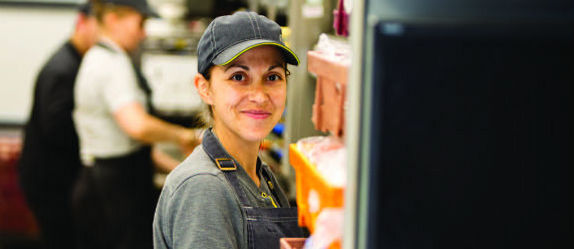 A McDonald’s Crew Member working in the kitchen