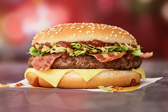 Picture of the BBQ Big Tasty® with beef, cheese, onions, brown BBQ sauce on a golden bun.