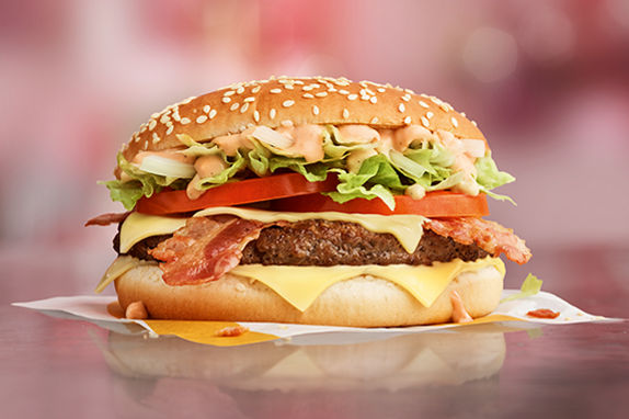 Picture of the Big Tasty® Bacon with bacon, cheese, onions, brown sauce on a golden bun.