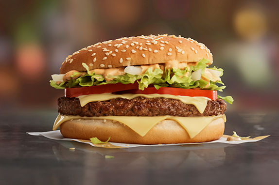 Picture of the Big Tasty® with beef, cheese, onions on a golden bun.