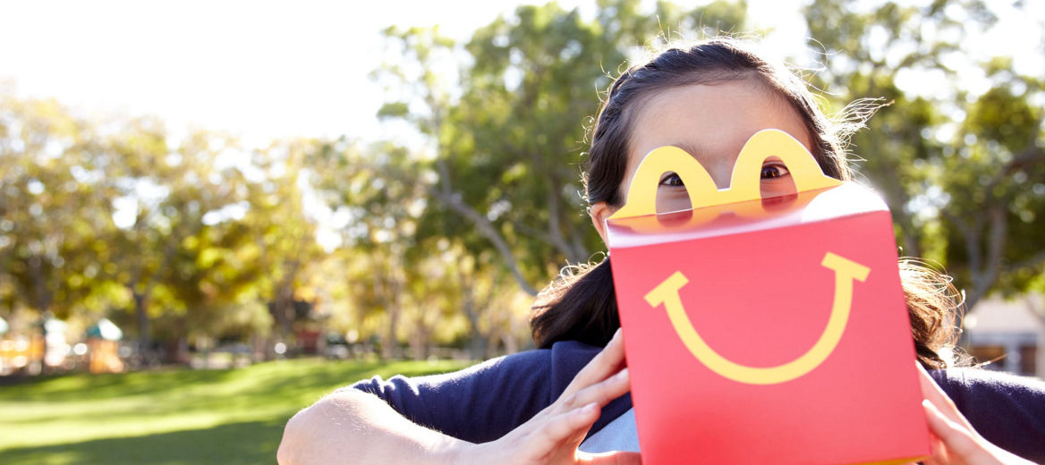 woman holding Happy Meal box