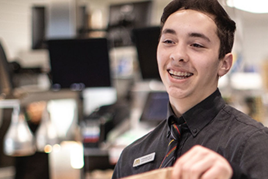 McDonald's staff serving food over the counter