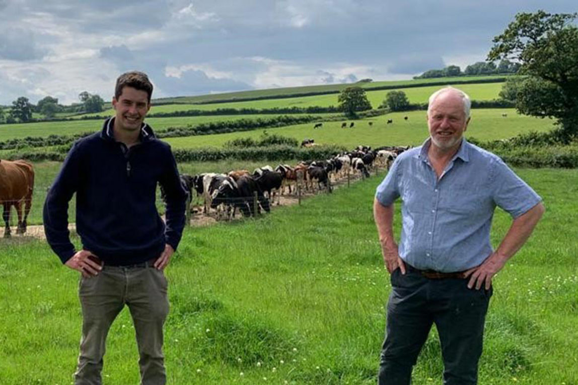 Flagship framers, Mike and Will, in a field.