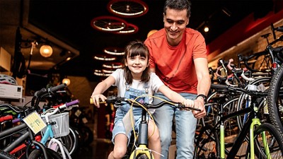 Girl and Man riding bikes