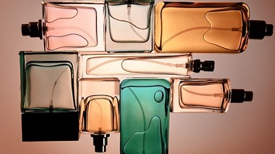 Perfumes with a light behind it to show the colored glass bottles