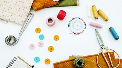Sewing crafting supplies organized on a table