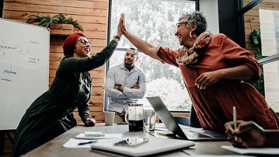 Team meeting with people smiling