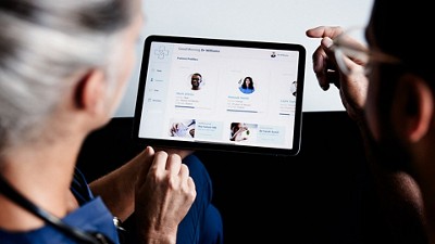 Doctors interacting with an iPad portal