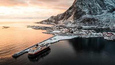 Cruise ship entering snowy port harbor
