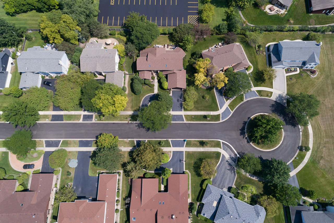 Aerial view of a tree-lined neighborhood in a cul-de-sac.