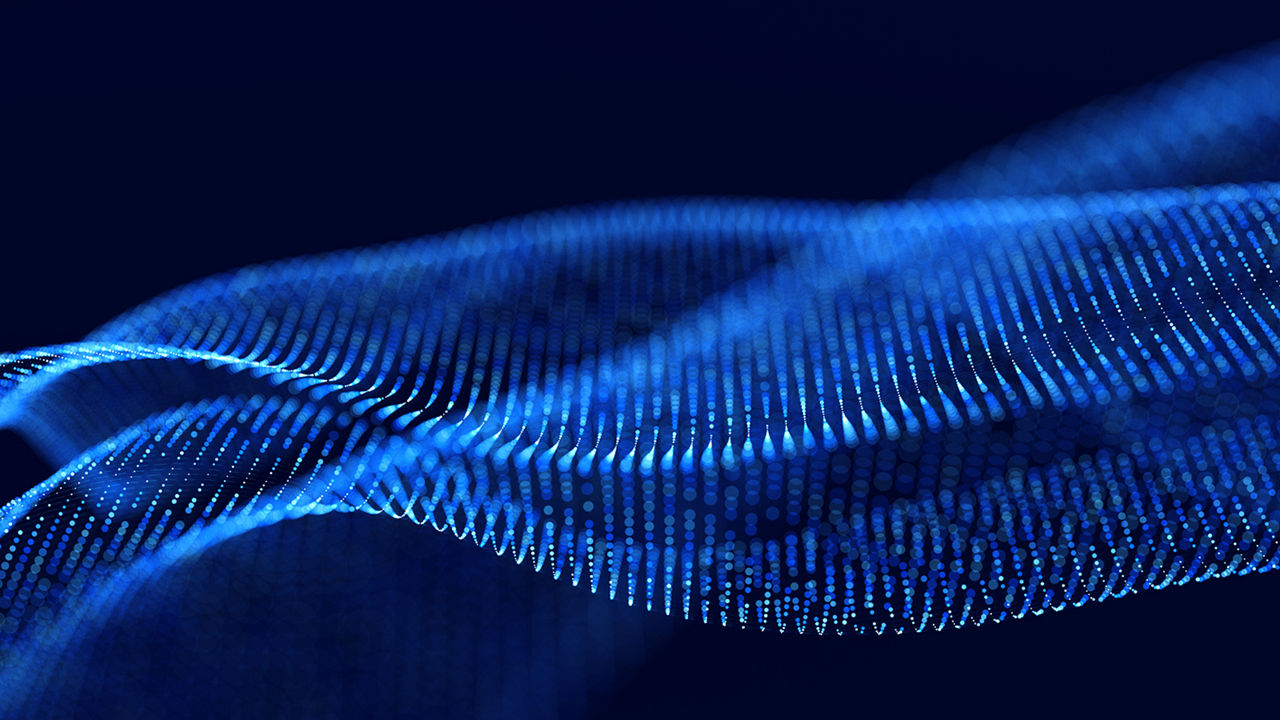 Abstract blue particles forming waves on a dark background