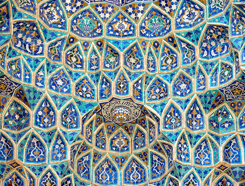 Built in 14th century, the mosque is crowned by a pair of minarets, the highest in Iran, and the portal's facade is decorated in dazzling tile work, predominantly blue in colour.