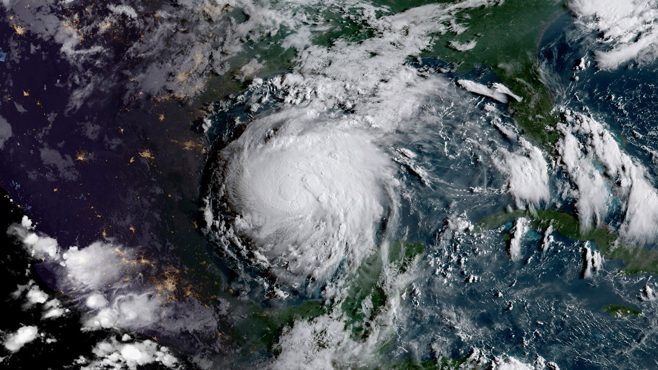 August 24, 2017 - Geocolor image of Tropical Storm Harvey in the Gulf of Mexico. Geocolor imagery enhancement shown here displays geostationary satellite data in different ways depending on whether it is day or night. This image, captured as daylight moves into the area, offers a blend of both, with nighttime features on the left side of the image and daytime on the right.