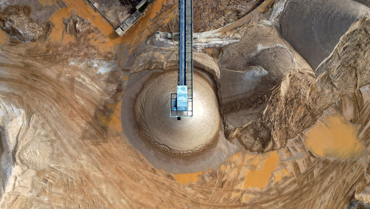 Overhead aerial view of a stone crusher machine at a quarry