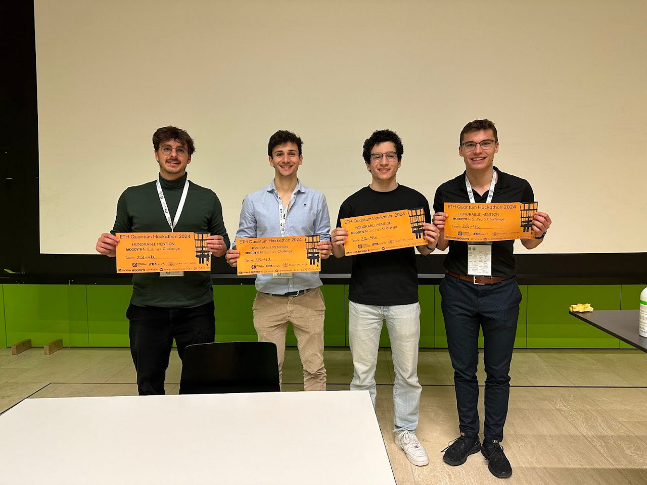 Photograph and quote from the team that received the honorable mention 2Q-4U. From left to right: David Schrago, Rodrigo Martínez Sanz, Nessim Dridi, Constantin Schuchardt.
