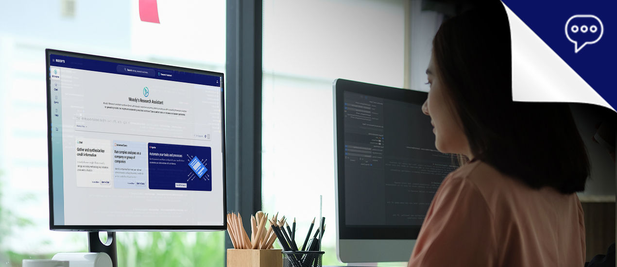 Woman and man pointing at monitor