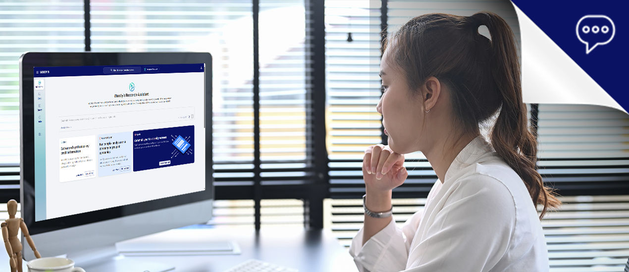 Woman and man pointing at monitor