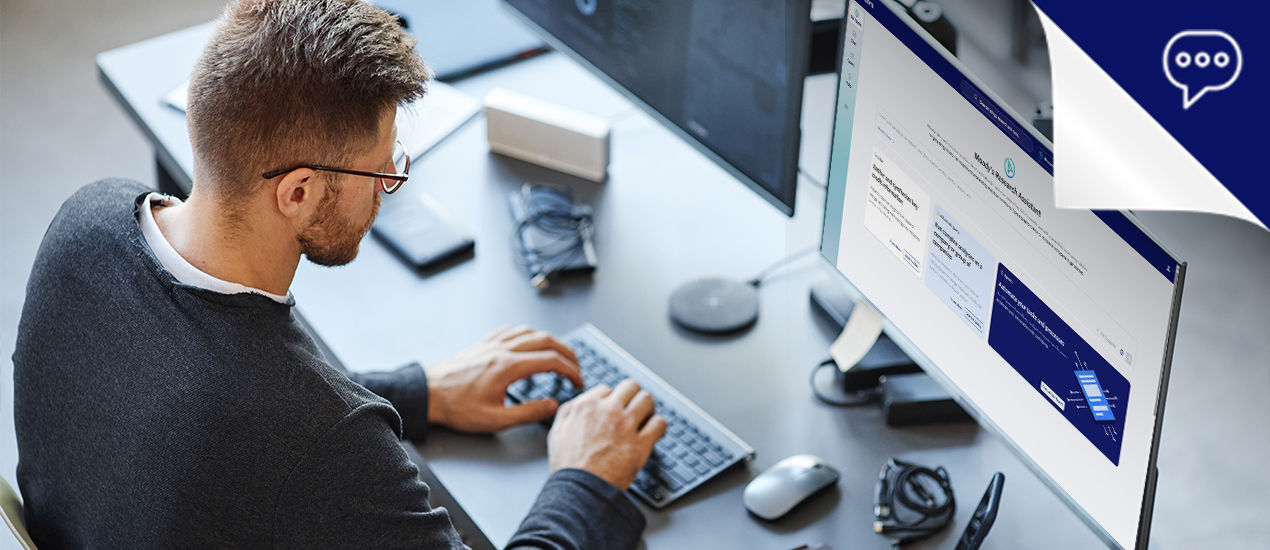 Woman and man pointing at monitor