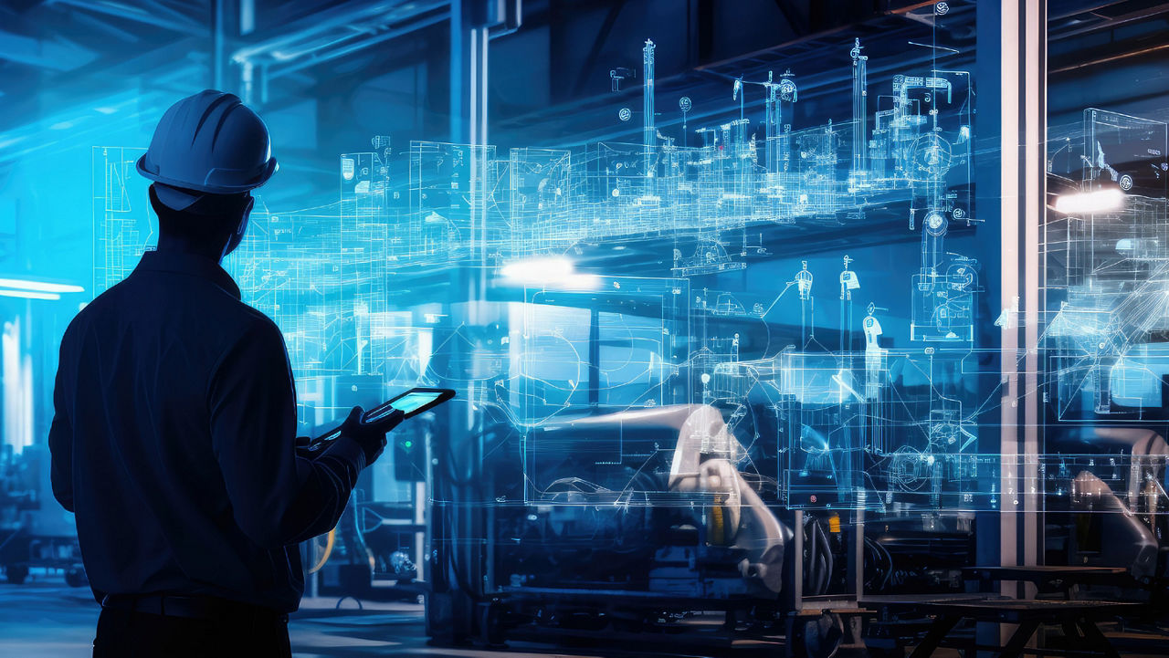 Construction worker looking at blue digital diagrams