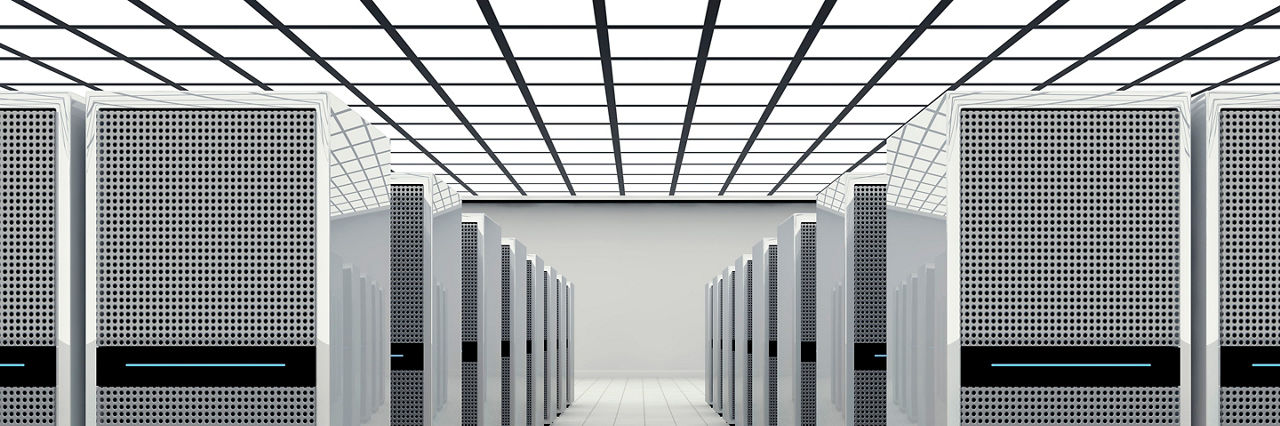 Data center in a large bright room with lots of computer cabinets
