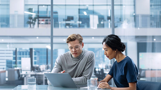 Multiethnic Diverse Office Conference Room Meeting: Team of Two Creative Entrepreneurs Talk, Discuss Growth Strategy. Stylish Young Businesspeople work on Investment and Marketing Projects.