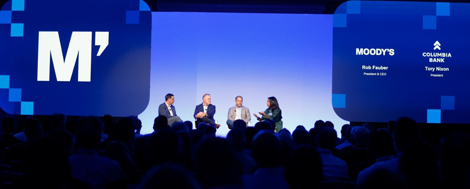 Moody's speakers on stage
